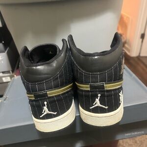 Jordan Black & Gold Pinstripe High-Top Sneakers